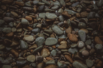 Pebble stone background sea rocks background. Sea stones background.