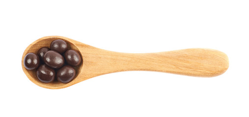 Wooden spoon full of candies