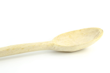 Large kitchen wooden spoon isolated on a white background. Selective focus.