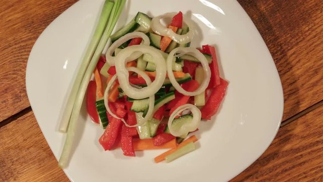 Healthy salad with fresh vegetables. Dietetic foods from environmentally friendly organic products. Vegetables from his garden. Slider dolly (1080p 25 fps; canon 7d, Sigma 24-70)