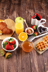 breakfast in bed with fruits and pastries on a tray -waffles, cr