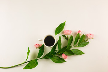 Valentine still life with pearl ring in man hand, red roses and woman hand with coffee