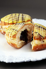 German donuts - berliner with jam and icing sugar in a tray on a