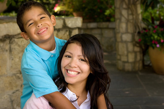 Happy Hispanic Mother And Her Son.