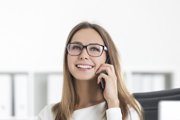 Close up of smiling girl on phone