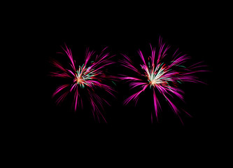 Two colorful fireworks on black background at international comp