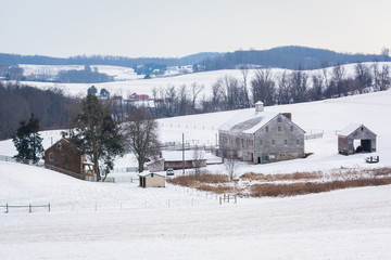 View of a snow covered farm and rolling hills, near Shrewsbury,