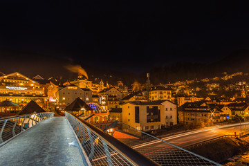 night view of modern bridge to mountain village