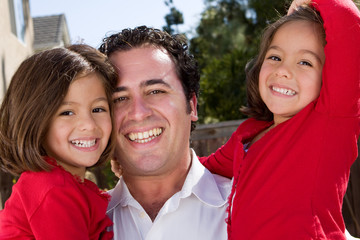 Obraz premium Happy Hispanic father and his daughter.