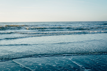 Fototapeta na wymiar Waves in the Atlantic Ocean, in Folly Beach, South Carolina.