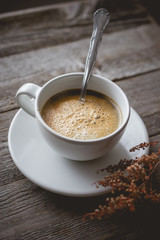 Chill and Relax with Hot Coffee and Dry Flower on old  wooden in