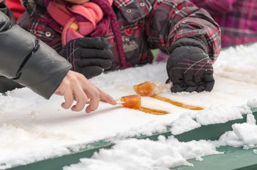 Maple taffy on snow at the sugar shack, in Montreal, Canada (2017)