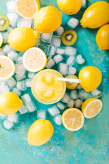 Fototapeta na wymiar Orange juice. Orange smoothie on a turquoise background..Kiwi. Cocktails. Detox Juice. Summer drink. Healthy food concept