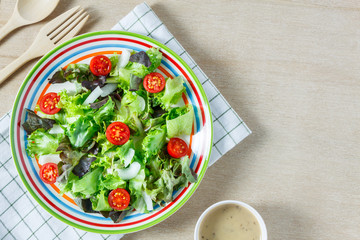 Top view cooking salad with sauce on wood table with copy space.
