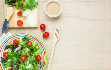 Top view cooking salad with sauce on wood table with copy space.