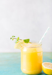 Orange juice. Orange smoothie on a turquoise background..Kiwi. Cocktails. Detox Juice. Summer drink. Healthy food concept