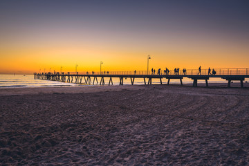 People walking on pier