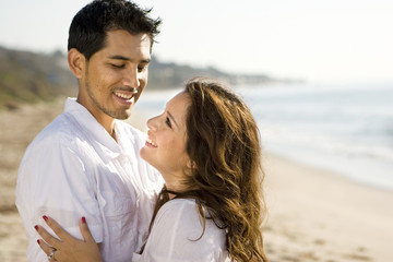 Obraz premium Beautiful Hispanic couple laughing and smiling.