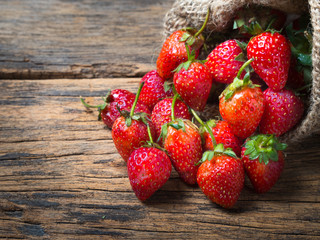 strawberries on old wooden background