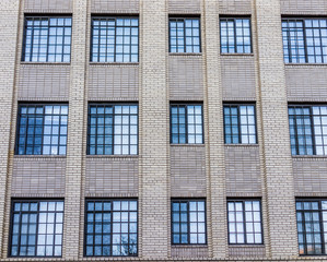 Many blue windows on brick building