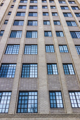 Many blue windows on brick building