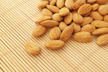 Almonds on bamboo background