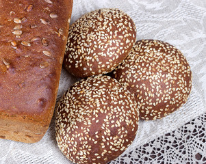 Freshly baked traditional bread on wooden table
