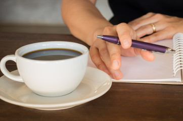 Hot cup of coffee on working table