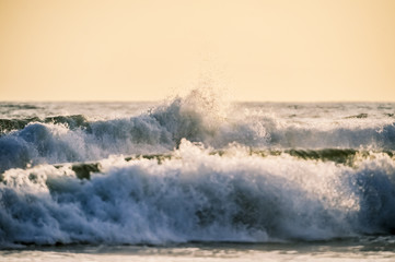 Wave crashing on to shore