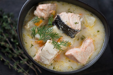 Close-up of finnish fish soup with salmon fillet, high angle view