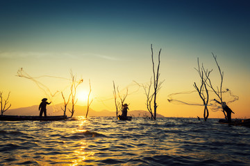 Fisherman of Bangpra Lake in action when fishing, Thailand.