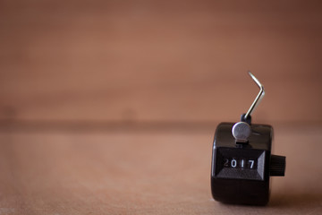 2017 number counter on blur wood background