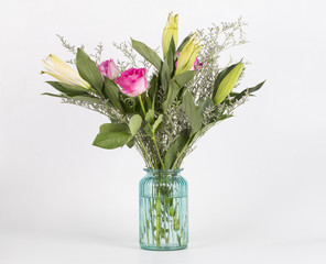 Bouquet of colorful flowers arranged in vase.