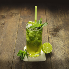 Mojito cocktail with mint leaves and lime