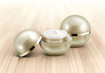 Golden sphere cosmetic jar on wood background
