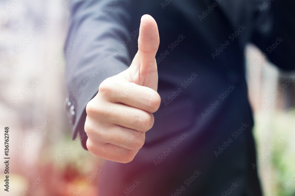 Wall mural businessman shows thumb up