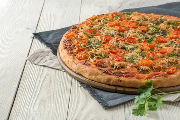 Foto op Plexiglas cooked pizza on a wooden background © Alexander Gogolin