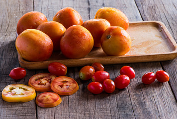 Fototapeta na wymiar Tomatoes yellow and red with slice tomatoes