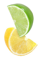 hanging, falling, flying cutting piece of lemon and lime fruits isolated on white background with clipping path