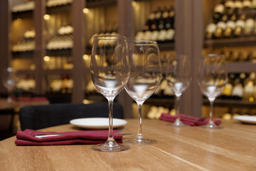 Restaurant table with wine fridge in the background