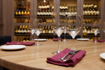 Restaurant table with wine fridge in the background