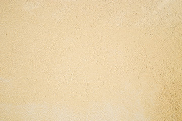 yellow beige plastered wall as background