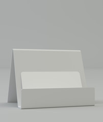 Blank business card on the holder on gray background with reflection