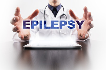 Medical doctor using tablet PC with epilepsy medical concept.