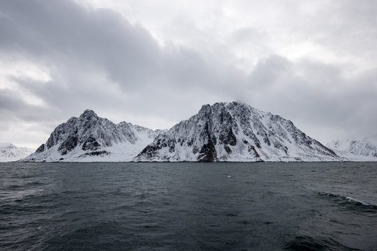 Gray cloudy mountains in svalbard