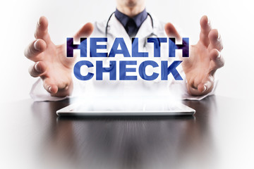 Medical doctor using tablet PC with health check medical concept.