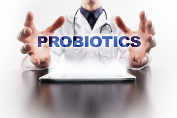 Medical doctor using tablet PC with probiotics medical concept.