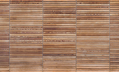Texture of a modern wooden gate made of slats