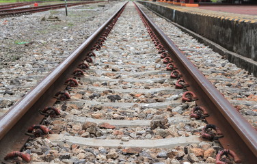 Naklejka premium railway track on gravel with concrete rail ties