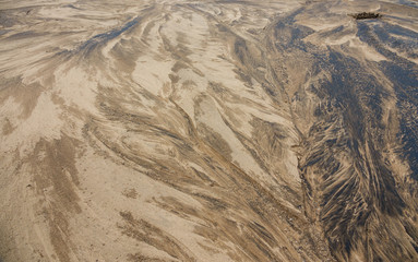 Fototapeta na wymiar Sand in riverbed, background texture